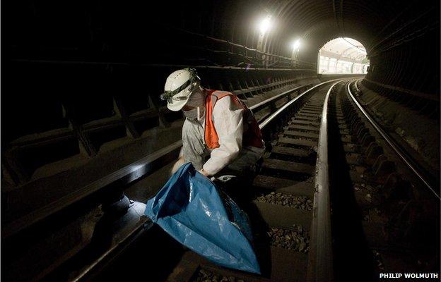 A member of the Deep Cleaning Gang employed by a sub-contractor working through the night at Edgware Road tube station on the Bakerloo Line