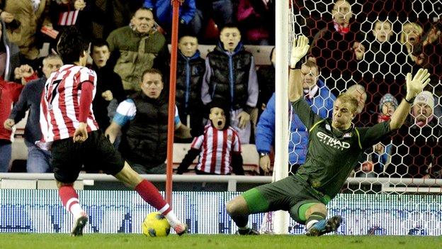 Ji Dong-won scoring as Joe Hart stretches for the ball.