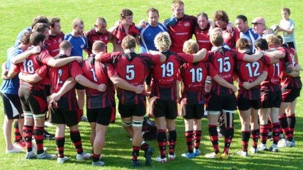 Jersey team huddle