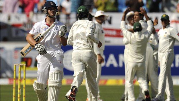 Jonathan Trott departs after being trapped lbw by Umar Gul