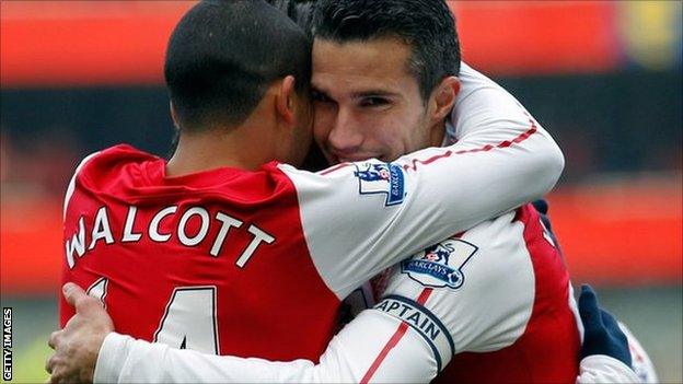 Robin Van Persie celebrates with Theo Walcott