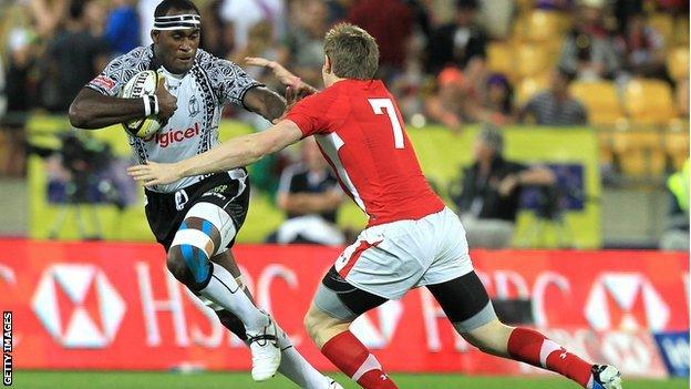 Sekonaia Kalou of Fiji is tackled by Mathew Pewtner of Wales