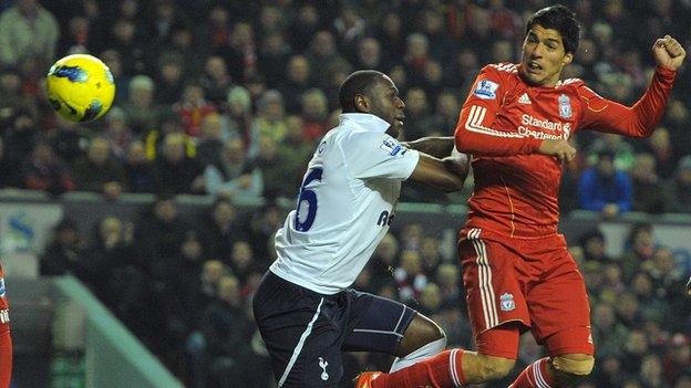 Luis Suarez beats Ledley King to a header