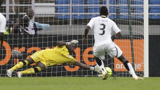 Zambia's Kennedy Mweene saves a penalty from Asamoah Gyan in Bata