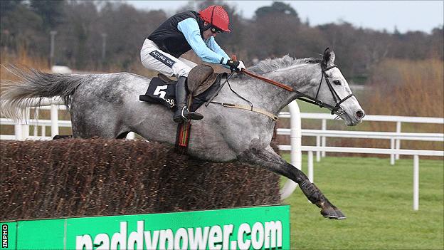 Quel Esprit jumps the last at Leopardstown to win the Irish Hennessy Gold Cup