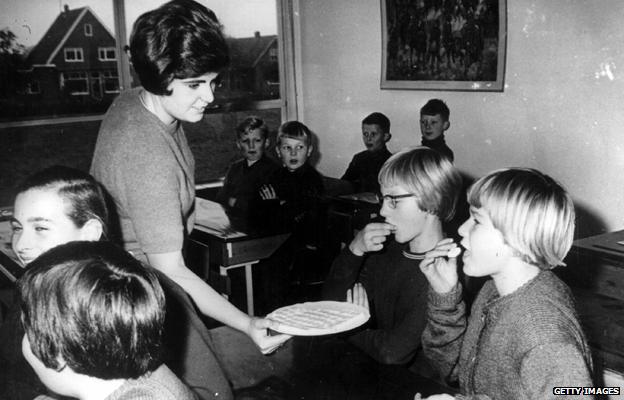 Schoolchildren in Holland receive the oral polio vaccine.