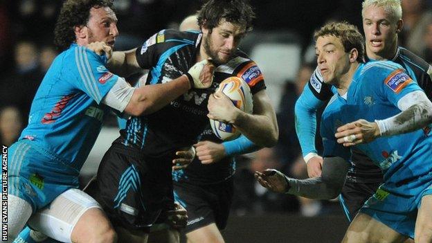 Aironi’s Mauro Bergamasco tackles Ospreys centre Andrew Bishop