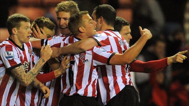 Sunderland celebrate after scoring against Arsenal