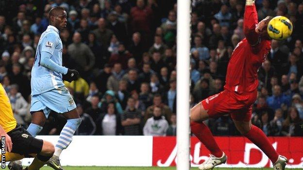 Mario Balotelli (right) scores for Manchester City