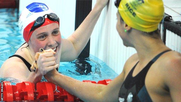 Britain's Hannah Miley shakes hands with Stephanie Rice of Australia at the 2008 Beijing Olympics