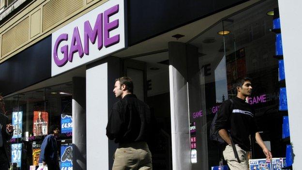 Shoppers pass a Game store in a high street