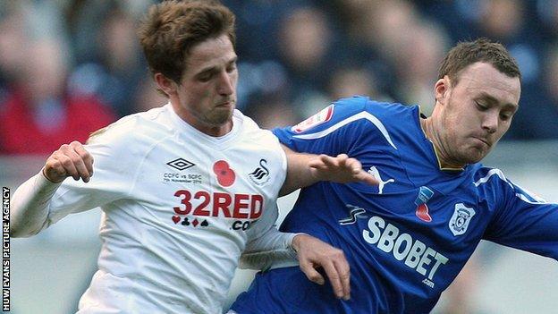 Swansea City's Joe Allen battles with Cardiff City's Darcy Blake