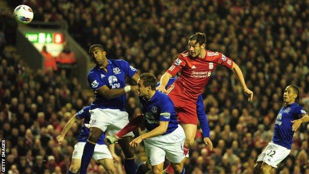 Sylvain Distin and Andy Carroll