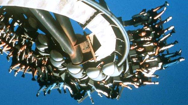 People on a rollercoaster