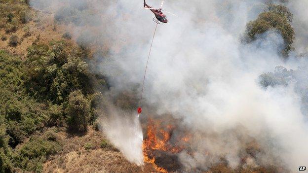 Helicopter drops water over fire on Mount Kenya