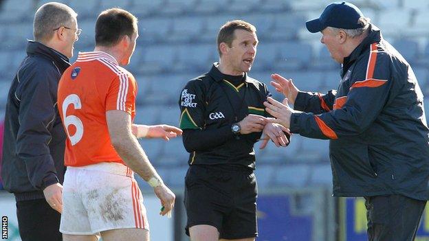 Armagh assistant boss Paul Grimley protests to referee Michael Duffy after Ciaran McKeever's dismissal