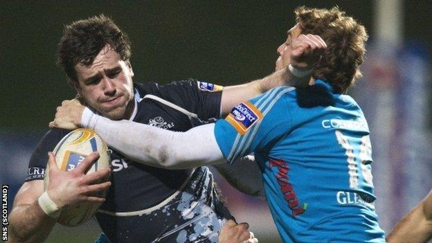 Glasgow's Alex Dunbar is tackled by Giulio Toniolatti
