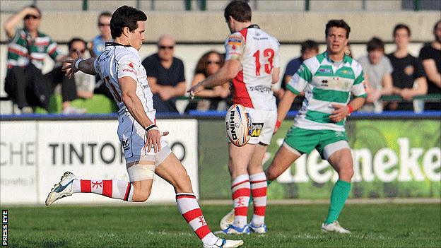 Ulster full-back Adam D'Arcy kicks the ball clear against Treviso