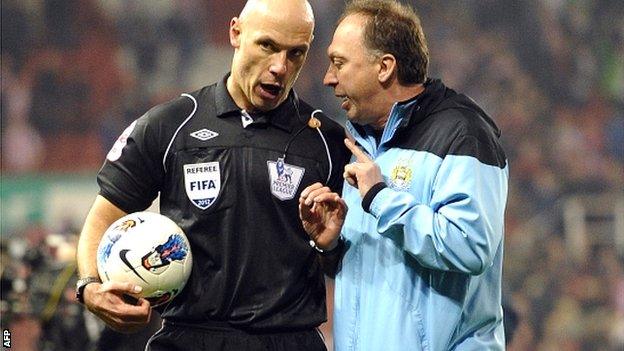 Manchester City coach David Platt (right) talks with referee Howard Webb after the draw at Stoke