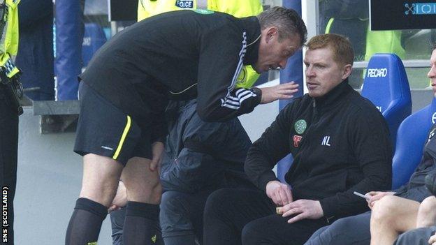 Fourth official Iain Brines has a word with Celtic manager Neil Lennon