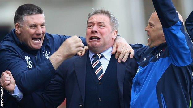 McCoist (centre) celebrates as his side head for victory over their Glasgow rivals