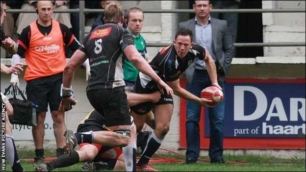 Cross Keys full-back Gareth David looks for the offload