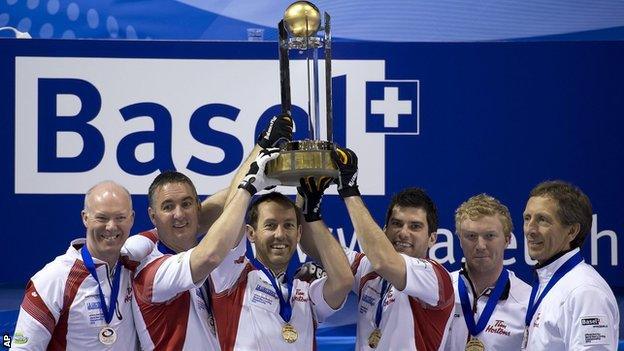 Canada celebrate with the trophy after their win against Scotland in the final of the World Men's Curling Championship