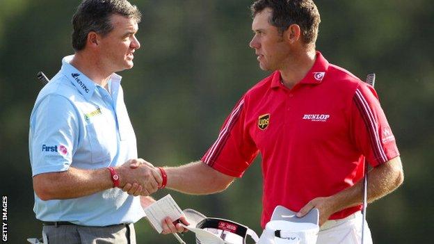 Lawrie and Westwood shake hands at the end of the final round at the Masters