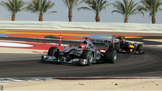 Michael Schumacher and Mark Webber at the 2010 Bahrain grand prix