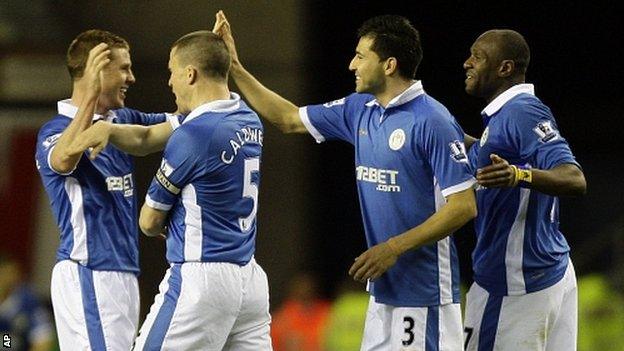 Wigan players celebrate their win over Manchester United