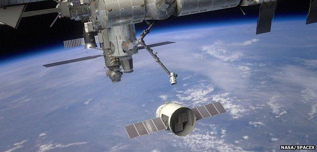 Artist's rendering of Dragon approaching ISS