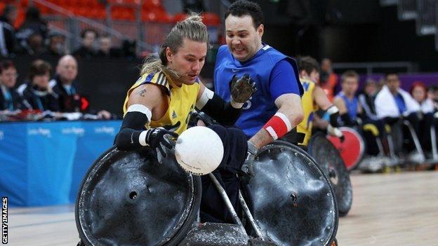 Sweden's Tobias Sandberg is challenged by Great Britain's Ross Morrison