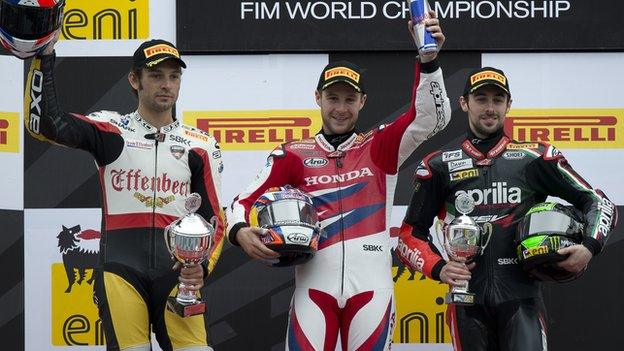 Jonathan Rea [centre] celebrates his Assen win on the podium with Eugene Laverty [right] and Sylvain Guintoli