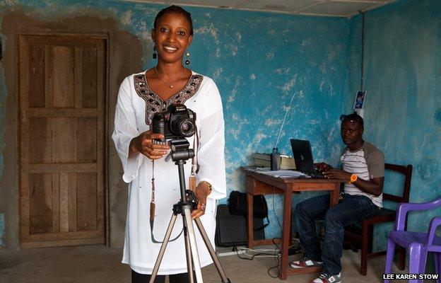 Rebecca Kamara in her village studio. Rebecca has set up her own photography business in her village in Sierra Leone, West Africa