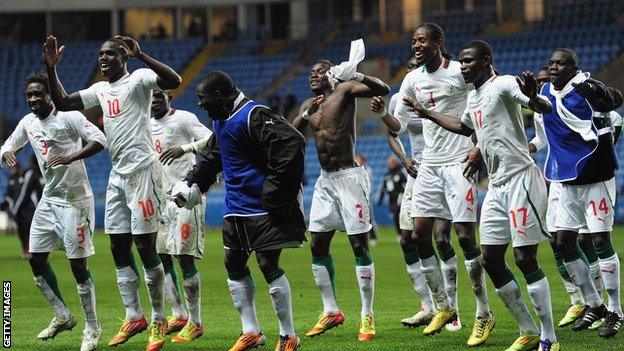 Senegal celebrate beating Oman