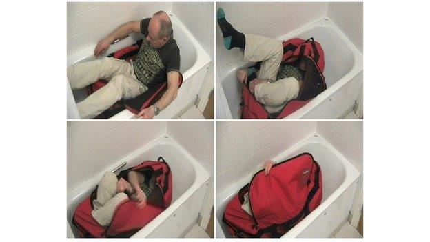 Man zipping himself in a bag