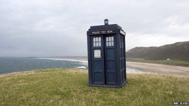 Doctor Who's Tardis on a cliff overlooking the sea at the Rhossili area on the Gower peninsula