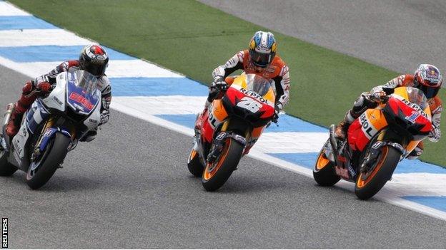 Jorge Lorenzo (left), Dani Pedrosa (middle) and Casey Stoner (right) battle for the lead at the Portugal MotoGP