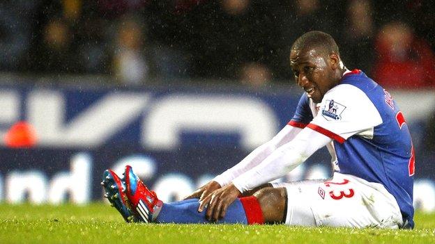 Junior Hoilett sits down looking dejected