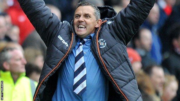 Paul Buckle celebrates guiding Luton into the play-off final.