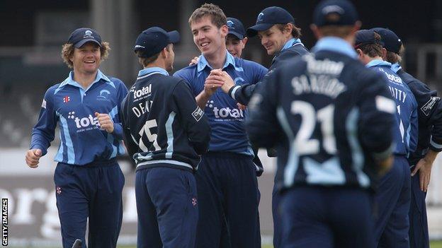 Graeme McCarter celebrates taking his first wicket against Middlesex