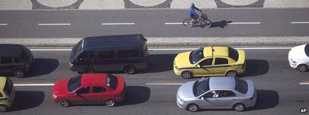 Lone cyclist in traffic