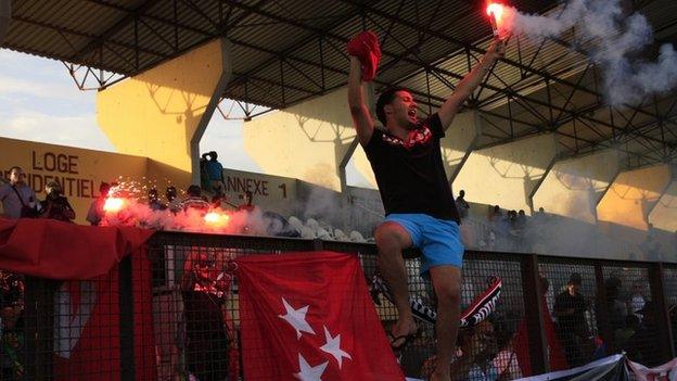 Etoile du Sahel fans celebrate their team's passage to the group phase in Ivory Coast