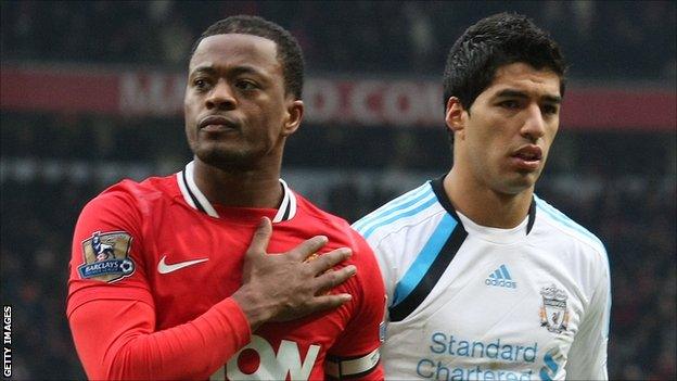 Manchester United's Patrice Evra (l) and Liverpool's Luis Suarez