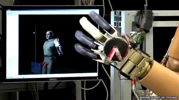 robotic hand in front of screen