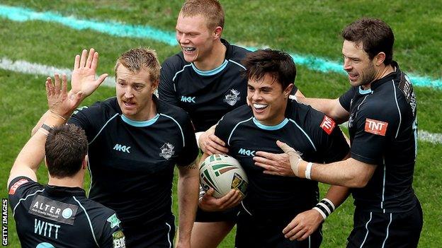 London Broncos players celebrate a try