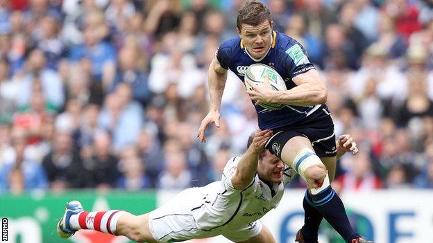 Brian O'Driscoll tries to burst away from Darren Cave's tackle at Twickenham