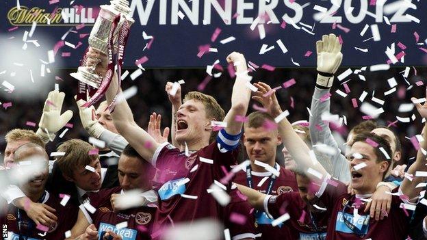 Hearts players celebrate after lifting the Scottish Cup