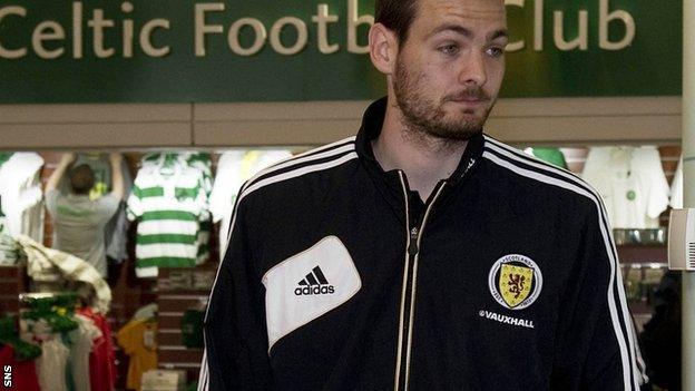 Gordon, who has been linked with Celtic, leaves Glasgow Airport with the Scotland squad