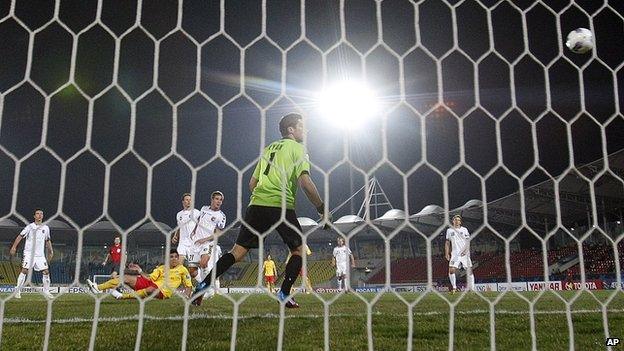 Goal keeper looking at ball